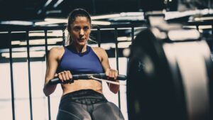 Cardio vs Strength Training. woman on treadmill